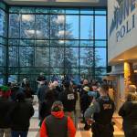 Dozens of police officers and volunteer elves gather at the Juneau Police Department station on Dec. 9 for a briefing before taking about 50 local children out for the annual Shop with a Cop organized by the Capital City Chapter of Alaska Peace Officers Association. (Photo courtesy of the Juneau Police Department)