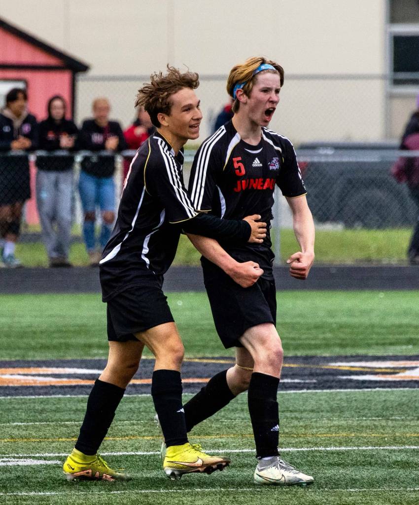 Juneau-Douglas High School: Yadaa.at Kalé sophomore Kai Ciambor and senior Kean Buss celebrate Buss goal against Soldotna during the Crimson Bears 4-0 win over the Stars for the ASAA DII Boys Soccer State Championship on Saturday, May 27, at West Anchorage High School. (Courtesy Photo / JDHS Soccer)