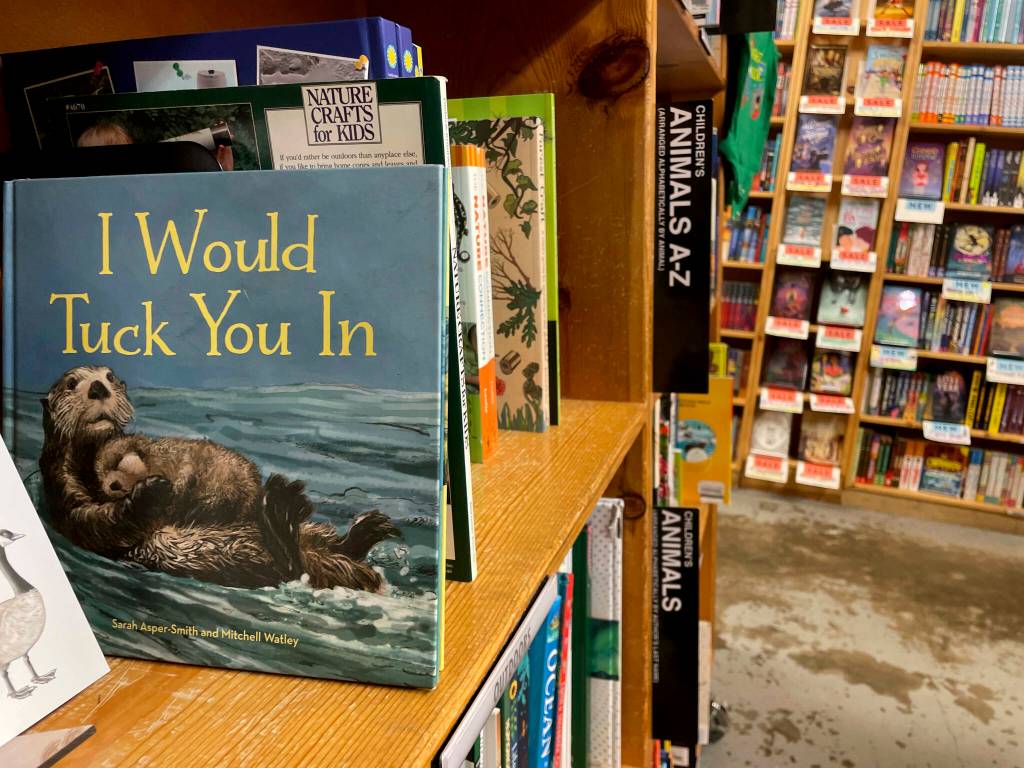 The childrens book I Would Tuck You In, illustrated by Mitchell Thomas Watley, is shown at a bookstore in Portland, Ore. in this April 5 photo. Publisher Sasquatch books, owned by Penguin Random House, said the same day it has ended its publishing relationship with Watley after he was arrested on allegations of leaving violent, transphobic notes in stores around Juneau. Watley told police he was motivated by fear following a deadly school shooting in Nashville that sparked online backlash about the shooters gender identity, court records show. (Claire Rush / AP file photo)