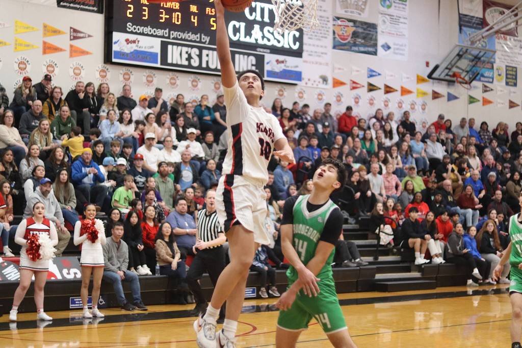 Jhowel Estigoy (#10) goes in for a layup for Juneau-Douglas High School: Yadaa.at Kalé during Saturday nights game against Albuquerque High School in the Capital City Classic at JDHS. (Mark Sabbatini / Juneau Empire)