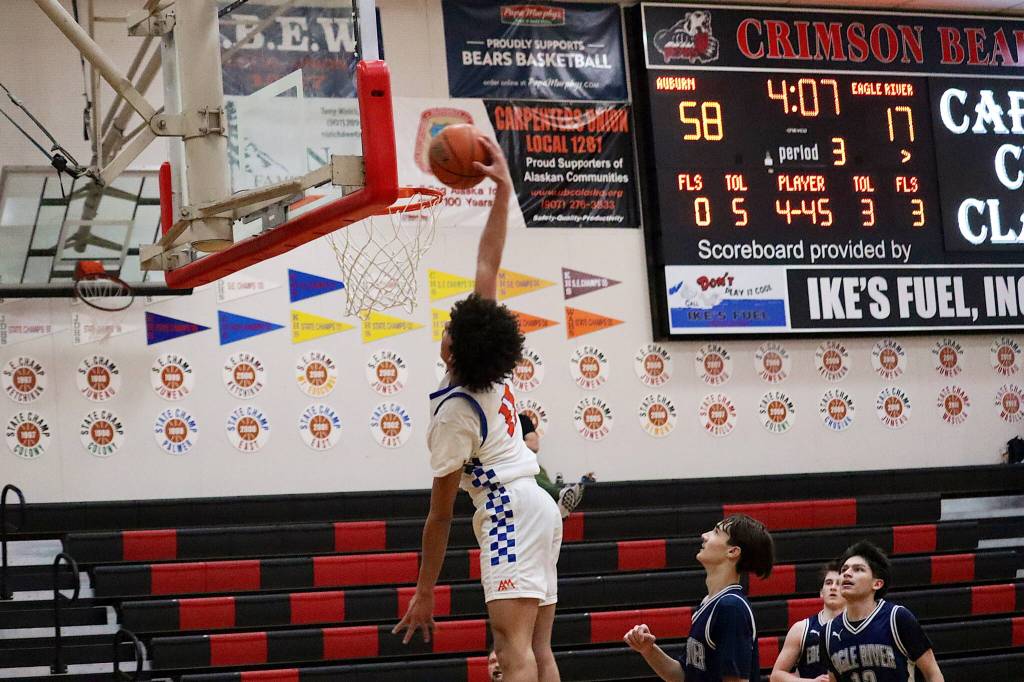 Caleb Bowden dunks the ball for Auburn Mountainview High School during its lopsided victory over East River High School during the Capital City Classic on Saturday. (Mark Sabbatini / Juneau Empire)