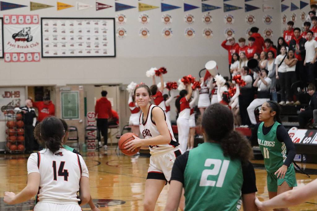 Juneau-Douglas High School: Yadaa.at Kalés Mila Hargrave (#24) looks to pass inside to teammate Layla Tokuoka) during their matchup against Albuquerque High School in the Capital City Classic at JDHS on Saturday night. (Mark Sabbatini / Juneau Empire)