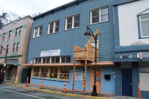 The former Glory Hall shelter on South Franklin Street is sealed off from the public on Tuesday as workers inside convert the building to low-income apartments in the upper section and commercial space on the ground floor. (Mark Sabbatini / Juneau Empire)