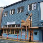 The former Glory Hall shelter on South Franklin Street is sealed off from the public on Tuesday as workers inside convert the building to low-income apartments in the upper section and commercial space on the ground floor. (Mark Sabbatini / Juneau Empire)