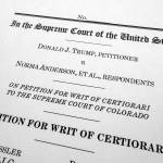 A page from the appeal by former President Donald Trump asking the U.S. Supreme Court to review the Colorado Supreme Courts finding that an insurrection clause in the Constitutions 14th Amendment renders Trump ineligible to be on the states ballot over his role in the Jan. 6, 2021, U.S. Capitol attack, is photographed Wednesday, Jan. 3, 2024. (AP Photo/Jon Elswick)