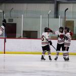 Juneau-Douglas High School: Yadaa.at Kalé players celebrate after scoring one of their 13 goals in a shutout win against Homer High School on Saturday at Treadwell Arena. (Mark Sabbatini / Juneau Empire)
