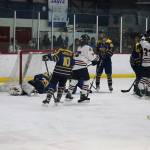 Juneau-Douglas High School: Yadaa.at Kalé players celebrate following the final goal in JDHS 13-0 win Saturday at Treadwell Arena. (Mark Sabbatini / Juneau Empire)