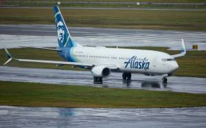 Alaska Airlines flight 1276, a Boeing 737-900, taxis before takeoff from Portland International Airport in Portland, Ore., on Saturday. The FAA has ordered the temporary grounding of Boeing 737 MAX 9 aircraft after part of the fuselage blew out during a flight. (AP Photo/Craig Mitchelldyer)