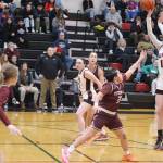 Gwen Nizich takes a jump shot for Juneau-Douglas High School: Yadaa.at Kalé against Ketchikan High School on Saturday night at JDHS. Nizich led the Crimson Bears with 25 points in their 45-40 win. (Mark Sabbatini / Juneau Empire)