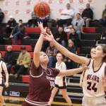 Juneau-Douglas High School: Yadaa.at Kalés Mila Hargrave (#24) and Bella Whisenant (#44) fight for the ball during Saturdays game at JDHS. (Mark Sabbatini / Juneau Empire)