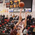 Chole Casperson (#11) goes up for a rebound for Juneau-Douglas High School: Yadaa.at Kalé during Saturdays game against Ketchikan High School at JDHS. (Mark Sabbatini / Juneau Empire)