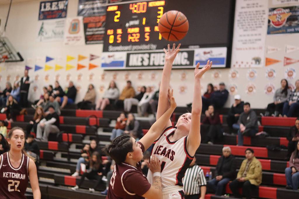 Chole Casperson (#11) goes up for a rebound for Juneau-Douglas High School: Yadaa.at Kalé during Saturdays game against Ketchikan High School at JDHS. (Mark Sabbatini / Juneau Empire)