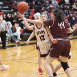 Juneau-Douglas High School: Yadaa.at Kalés Nadia Wilson (#12) is fouled by Ketchikan High Schools Bella Whisenant (#44) during Saturdays game at JDHS. (Mark Sabbatini / Juneau Empire)