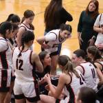 Tanya Nizich, head coach of Juneau-Douglas High School: Yadaa.at Kalés girls basketball team, gives instructions to players during the closing minutes of Saturdays game against Ketchikan High School at JDHS. (Mark Sabbatini / Juneau Empire)