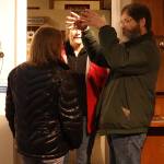 Joe Buck, a former city engineer who moved to Juneau in 1967, explains how an item displayed in an exhibit of local telephone history is similar to what his uncle worked on many decades ago. (Mark Sabbatini / Juneau Empire)