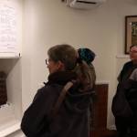 Guests at the debut of the Juneau-Douglas City Museums Switch and Exchange: A Brief History of Telephones in 20th Century Juneau examine equipment and historic displays during the exhibits opening on Friday. (Mark Sabbatini / Juneau Empire)