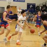 T.J. Guevarra takes the ball into the lane for Thunder Mountain High School during Saturdays game against Sitka high School at TMHS. (Mark Sabbatini / Juneau Empire)