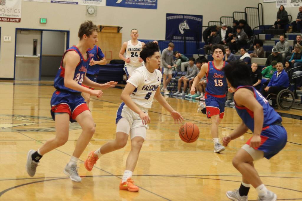T.J. Guevarra takes the ball into the lane for Thunder Mountain High School during Saturdays game against Sitka high School at TMHS. (Mark Sabbatini / Juneau Empire)