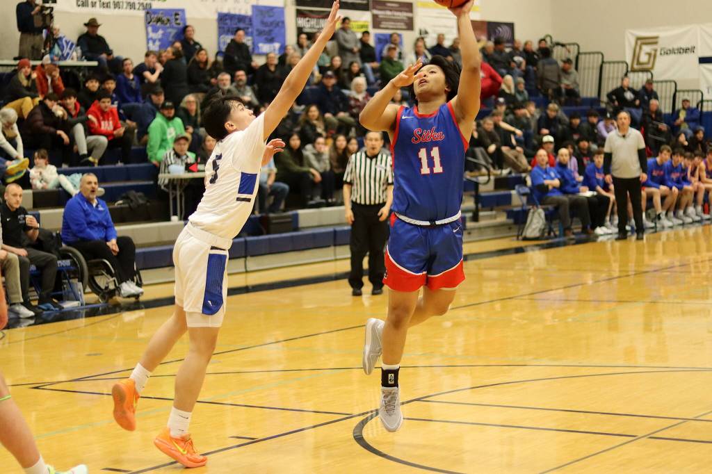Sitka High Schools Jayden Costello goes up for a shot under the basket during Saturdays game at Thunder Mountain High School. (Mark Sabbatini / Juneau Empire)