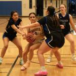 Hoonahs Krista Howland (1) drives against Thunder Mountain junior varsity players during the inaugural Elizabeth Peratrovich Womens High School Basketball Invitational Tournament on Thursday at Thunder Mountain High School. The tournament runs through Saturday. (Klas Stolpe / For the Juneau Empire)