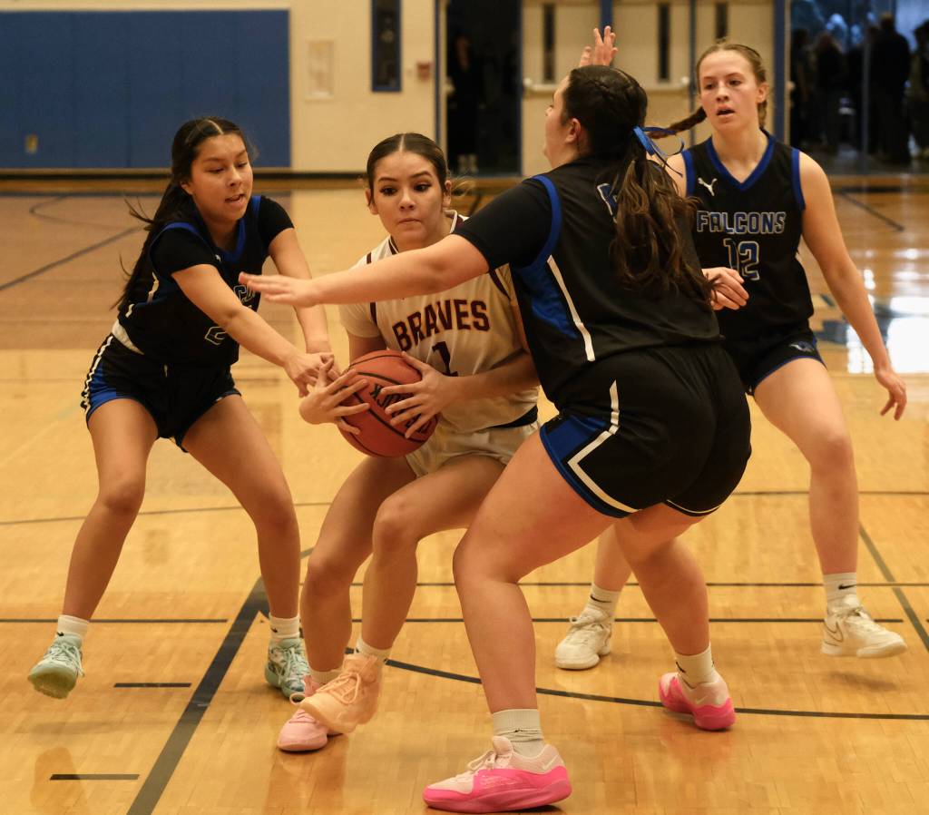 Hoonahs Krista Howland (1) drives against Thunder Mountain junior varsity players during the inaugural Elizabeth Peratrovich Womens High School Basketball Invitational Tournament on Thursday at Thunder Mountain High School. The tournament runs through Saturday. (Klas Stolpe / For the Juneau Empire)