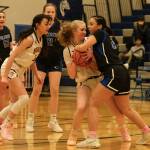 Hoonahs Paige Woitte and Thunder Mountain junior varsity player Addison Wilson battle for a ball during the inaugural Elizabeth Peratrovich Womens High School Basketball Invitational Tournament on Thursday at Thunder Mountain High School. The tournament runs through Saturday. (Klas Stolpe / For the Juneau Empire)