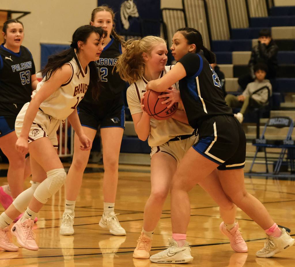 Hoonahs Paige Woitte and Thunder Mountain junior varsity player Addison Wilson battle for a ball during the inaugural Elizabeth Peratrovich Womens High School Basketball Invitational Tournament on Thursday at Thunder Mountain High School. The tournament runs through Saturday. (Klas Stolpe / For the Juneau Empire)