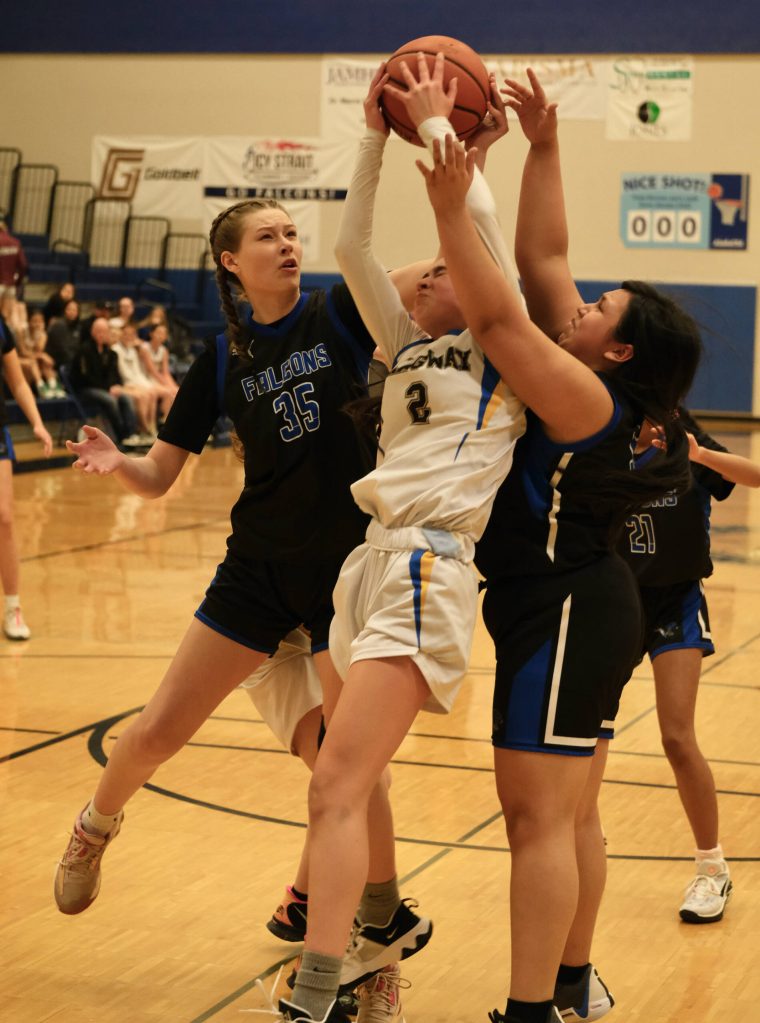 TMHS JV player Dannon Mills (35) and Skagways Millie Myers (2) battle for a rebound during the inaugural Elizabeth Peratrovich Womens High School Basketball Invitational Tournament on Thursday at Thunder Mountain High School. The tournament runs through Saturday. (Klas Stolpe / For the Juneau Empire)