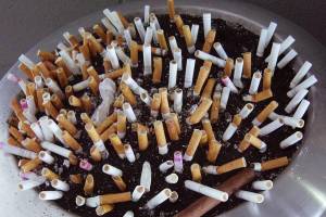 Cigarette butts are crammed into an ashtray outside one of the Atlanta office buildings used by the U.S. Centers for Disease Control and Prevention. The photo was taken in 2009, prior to the area becoming tobacco-free. In Alaska, the states anti-tobacco program has helped resident quit smoking or using smokeless tobacco or electronic cigarettes. (Photo by Dr. Oscar Tarragó/Division of Toxicology and Environmental Medicine/U.S. Centers for Disease Control and Prevention)