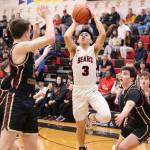 Alwen Carrillo (3) shoots in traffic for Juneau-Douglas High School: Yadaa.at Kalé during Saturday nights game against Grace Christian School at JDHS. (Mark Sabbatini / Juneau Empire)