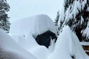 The roof of a building bears the weight of multiple feet of snow following two storms during the past two weeks that have dumped more than 60 inches of snow on some parts of Juneau. (Capital City Fire/Rescue photo)