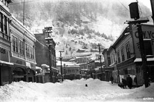 Looking east on Front Street from near Seward Street. The building in the right foreground painted C.W. Young is where Sealaska Heritages Walter Soboleff Center gift shop is located today. The Valentine Building is on the left. W.M. Case took the photo on Feb. 3, 1918. (Alaska State Library  Historical Collections P39-0545)