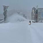 A city worker clears snow from the Seawalk in downtown Juneau this week. (City and Borough of Juneau photo)
