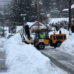A city worker clears streets in downtown Juneau following this weeks snowstorm. (City and Borough of Juneau photo)