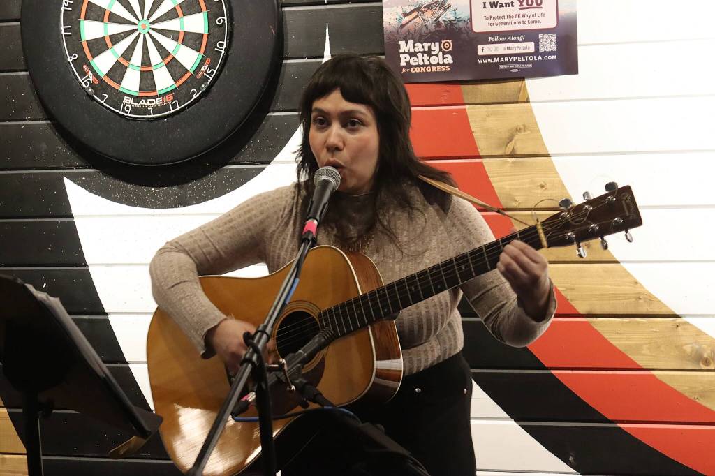 Nicole Church performs songs during a meet-and-greet for U.S. Rep. Mary Peltola at the Crystal Saloon on Saturday night. (Mark Sabbatini / Juneau Empire)