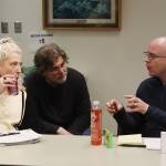 Assembly member Wade Bryson (right) discusses the Juneau School Districts financial situation with school board members David Noon and Britteny Cioni-Haywood during a break in a joint meeting of the Assembly and school board Tuesday night at City Hall. (Mark Sabbatini / Juneau Empire)