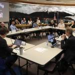 Members of the Juneau Assembly and Juneau Board of Education, along with top administrators for the city and school district, meet jointly to discuss the districts financial crisis on Tuesday night at City Hall. (Mark Sabbatini / Juneau Empire)