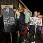 People carry signs at a Juneau rally in favor of an increase to the amount the government pays schools per student on Monday. (Photo by Claire Stremple/Alaska Beacon)