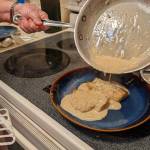 Pouring sauce over finished rockfish. (Photo by Patricia Schied)