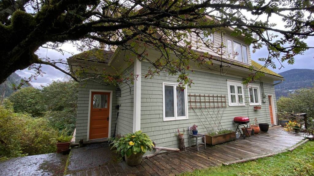 Historic 1913-14 Bosch-Carrigan House in autumn when vegetation is lush. (Photo by Skip Gray)