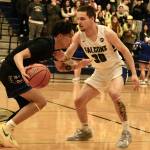 Thunder Mountain senior Thomas Baxter (30) defends Kodiak junior Kelly Ticman during the Falcons 71-49 home win over the Bears, Thursday at the Thunderdome. (Klas Stolpe / For the Juneau Empire)
