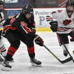 Kenai Centrals Avery Martin tries to split Juneau-Douglas High School: Yadaa.at Kales Dylan Sowa and Camden Kovach on Thursday at the Division II state hockey tournament at the Soldotna Regional Sports Complex in Soldotna. (Jeff Helminiak/Peninsula Clarion)