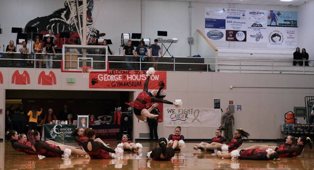 Members of the Juneau-Douglas High School: Yadaa.at Kalé dance team show their spirit during Saturdays Crimson Bears basketball game against Kodiak. (Klas Stolpe/For the Juneau Empire)