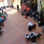 People gather in the eighth-floor atrium of the State Office Building for a free midday concert to open the first Juneau Jazz Festival on Thursday. (Mark Sabbatini / Juneau Empire)