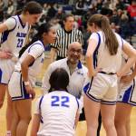 Thunder Mountain High School Head Coach Andy Lee confers with his players during a timeout in Saturdays game against Ketchikan High School at TMHS. (Mark Sabbatini / Juneau Empire)