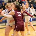 Thunder Mountain High Schools Kara Strong keeps the ball away from Ketchikan High Schools Kylie Brendible during Saturday nights game at TMHS. (Mark Sabbatini / Juneau Empire)