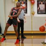 Juneau-Douglas High School: Yadaa.at Kalés Ahmir Parker celebrates during the games final seconds as Juneau-Douglas wins 78-74 over Ketchikan on Saturday at Ketchikan High School. JDHS split its games at Ketchikan, losing 63-47 on Friday. (Christopher Mullen/ Ketchikan Daily News)