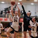 Juneau-Douglas High School: Yadaa.at Kalé senior Mila Hargrave (24) shoots under pressure from Thunder Mountain High School senior Ashlyn Gates (2) as JDHS sophomore Gwen Nizich (15) blocks out TMHS junior Cailynn Baxter (23) during the Crimson Bears 42-28 loss to the Falcons on Feb. 3 at the George Houston Gymnasium. The two teams split games during the weekend. (Klas Stolpe/Juneau Empire file photo)