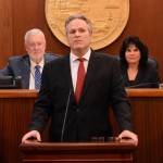 Gov. Mike Dunleavy delivers the State of the State address on Tuesday, Jan. 30, at the Alaska State Capitol. Behind him are Senate President Gary Stevens, R-Kodiak, and Speaker of the House Cathy Tilton, R-Wasilla. (Photo by James Brooks/Alaska Beacon)