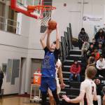 Kasen Ludeman is fouled while taking a shot for Thunder Mountain High School against Juneau-Douglas High School: Yadaa.at Kalé on Wednesday at JDHS. (Mark Sabbatini / Juneau Empire)